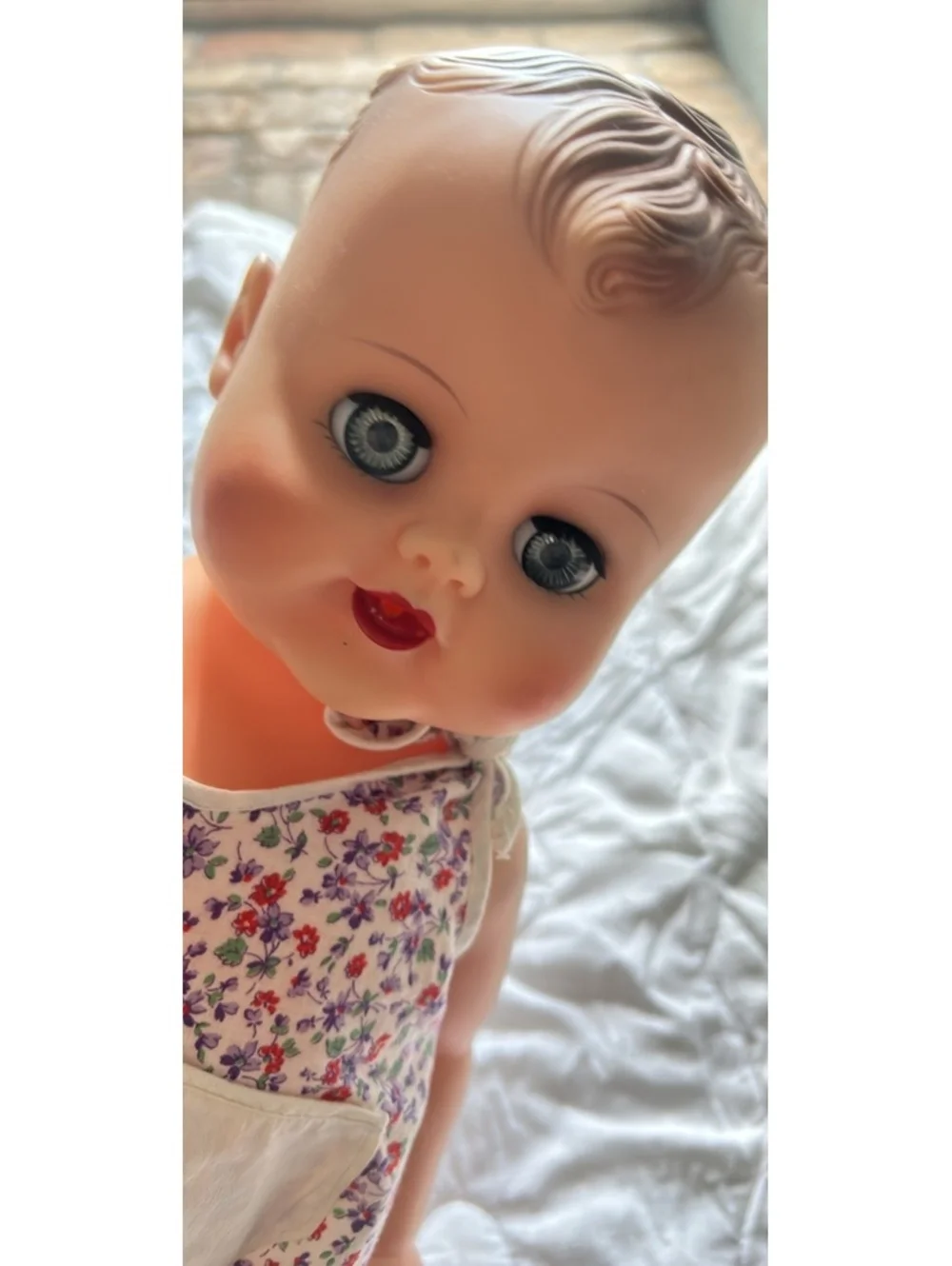 Vintage Baby Doll with Floral Romper and Moving Eyes